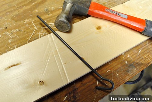 Make New Wood Look Aged: Simple Techniques for Authentic Patina 10 using metal rod and hammer to create long dents in new wood board to make it look old and beat up