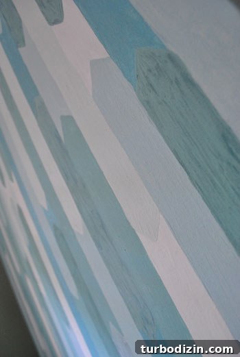 Create a Striking Geometric Canvas Painting: Step-by-Step Guide 7 Close-up of brush strokes and muted tones