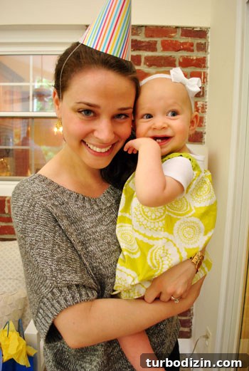 Throwing a Memorable First Birthday Party for Our Daughter 5 Clara in dress
