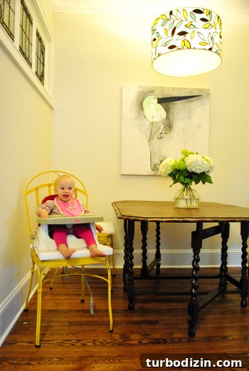 Sneaky Little Petersiks: Inside the Secret Lives of the Petersik Family 3 Kitchen nook with baby in booster seat