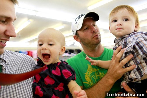 Thrifting Tips: How to Score Unique Finds at Secondhand Stores 7 Child playing with wooden spoon