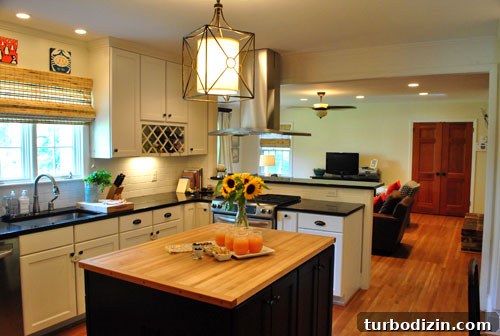 Stunning North Carolina Home Tour: Inside a Charming Southern Residence 6 Wide shot of kitchen opening to family room