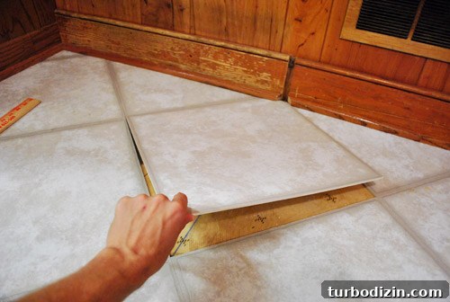 Removing Cabinets and Repairing Vinyl Floor Tile: Step-by-Step Guide 20 img 37273 22