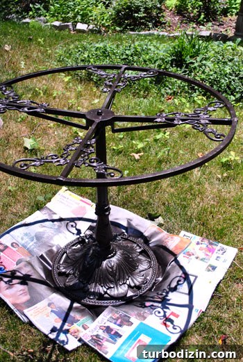Spray Painting a Metal Outdoor Patio Set: Step-by-Step Guide 8 Spraying patio furniture with oil-rubbed bronze