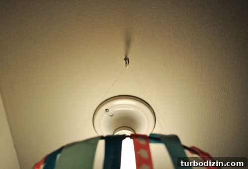DIY Ribbon Chandelier Tutorial: Step-by-Step Guide for a Stylish Fixture 8 Hooks and thread used to hang hoop