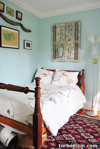 Guest room with colorful shutters and tin basket