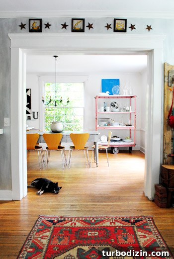 Dining room with pink cart and metal star decor