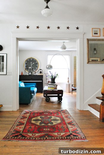 Living room with teal sofa and metal stars