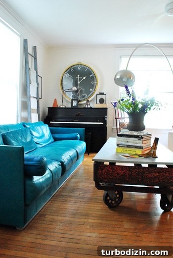 Living room with fireplace and tripod lamp