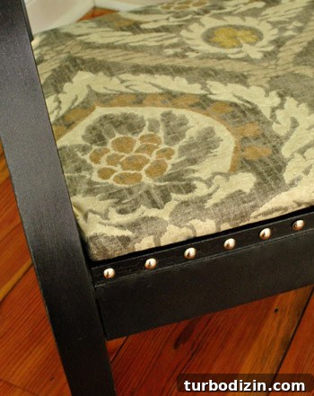 Reupholster a Rocking Chair With Fabric and Nailhead Trim in 7 Steps 15 Studded trim detail