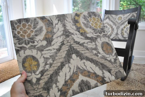 Reupholster a Rocking Chair With Fabric and Nailhead Trim in 7 Steps 9 Second panel installed