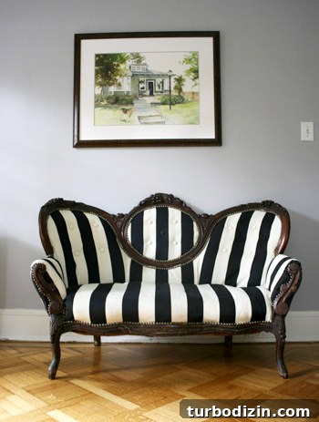 How to Reupholster a Loveseat Using Striped Fabric 3 Reupholstered loveseat side view