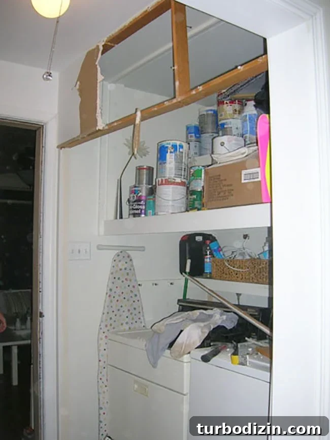 Removing Chair Rail and Demoing a Slate Path: Step-by-Step Guide 8 Open laundry nook after demolition