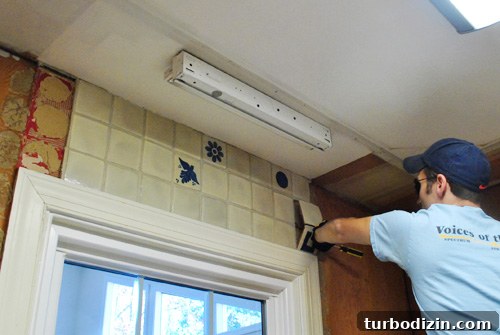 How to Remove Old Backsplash Tile and Plywood Safely 5 Removing tile pieces