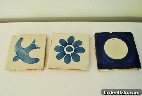 How to Remove Old Backsplash Tile and Plywood Safely 6 Three surviving blue tiles