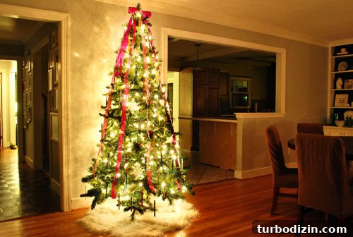 Kid-Friendly Christmas Tree Made from Paint Chips and Ribbons 11 Ribbon draped over tree and sheepskin tree skirt