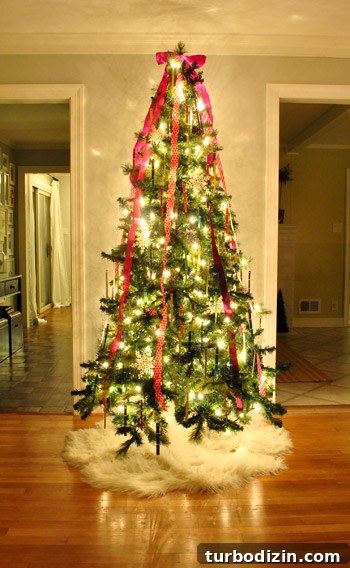 Kid-Friendly Christmas Tree Made from Paint Chips and Ribbons 12 Tree topped with a ribbon bow