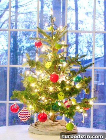 Kid-Friendly Christmas Tree Made from Paint Chips and Ribbons 19 Dining room Christmas tree glowing