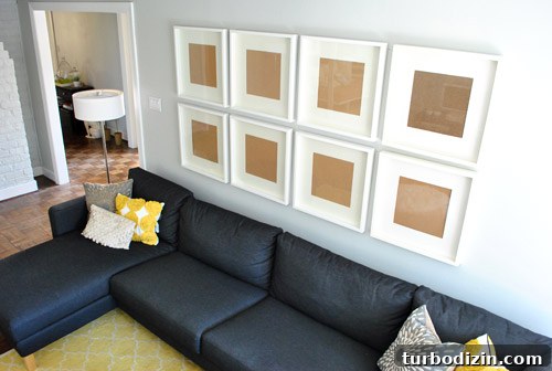 Planning frame arrangement above sofa