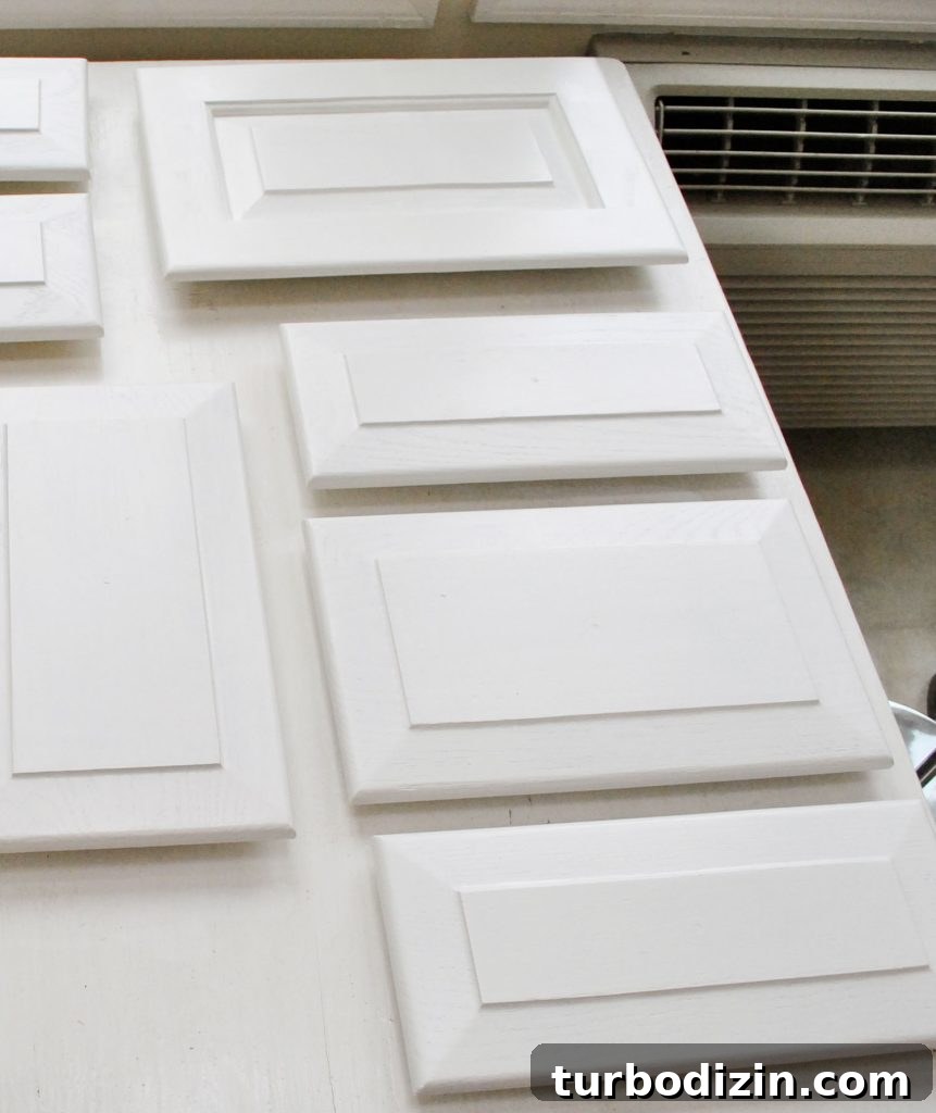How to Paint Kitchen Cabinets Like a Pro: Step-by-Step Guide 12 White Painted Kitchen Cabinet Doors Laid Out