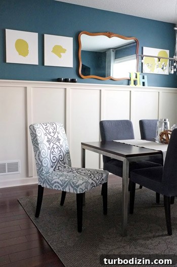 Dining Room with Board and Batten and Deep Blue Walls 4 Dyed chairs