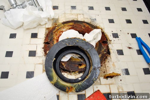 Fix a Wobbly Toilet: Quick Steps to Stabilize It Safely 14 Removing old rubber reinforcement ring with wax ring under toilet