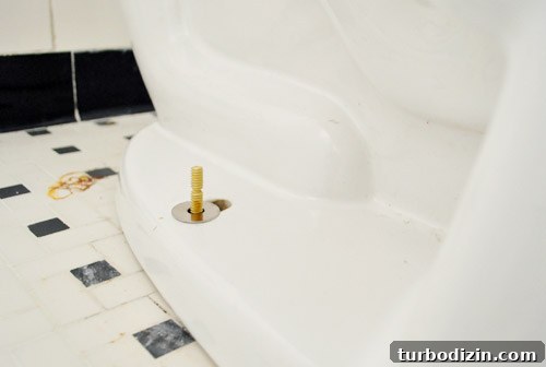 Fix a Wobbly Toilet: Quick Steps to Stabilize It Safely 21 New bolts installed under toilet to fix rocking toilet bowl