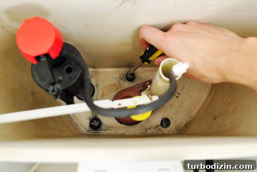 Fix a Wobbly Toilet: Quick Steps to Stabilize It Safely 24 Reinstalling toilet tank by tightening screws within toilet tank