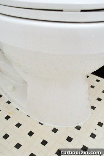 Fix a Wobbly Toilet: Quick Steps to Stabilize It Safely 26 Fresh caulk line around base of installed toilet