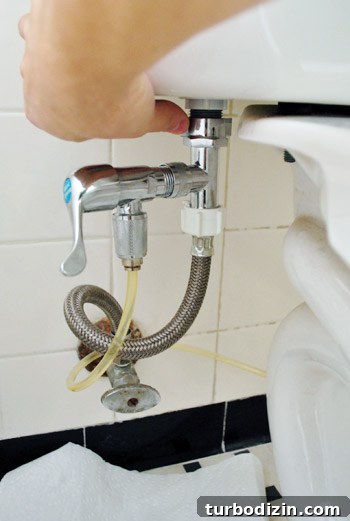 Fix a Wobbly Toilet: Quick Steps to Stabilize It Safely 5 Detaching water supply line from the underside of toilet tank