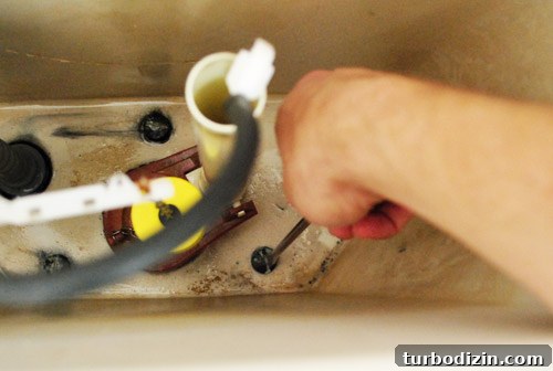 Fix a Wobbly Toilet: Quick Steps to Stabilize It Safely 7 Unscrewing toilet tank from the bowl from inside the drained tank