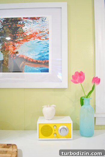 Buying Our First Major Artwork: Tips for New Collectors 8 Final framed piece in kitchen