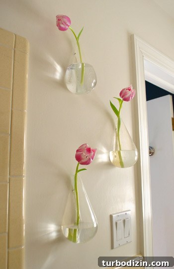 Floating Wall Vases: Stylish Mounted Flower Holders for Home Decor 3 Vases with flowers in guest bathroom