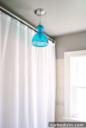 Blue pendant over shower