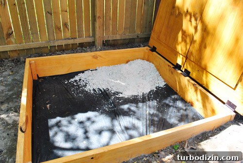 First bag of sand dumped in sandbox