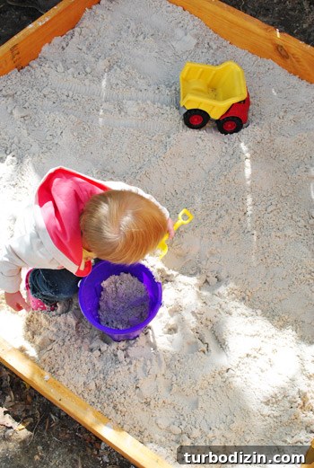 Sandbox next to patio seating