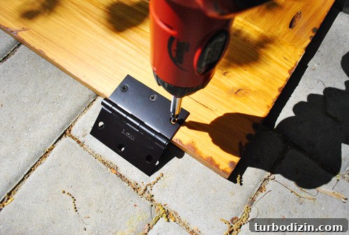 Hinged sandbox cover attached