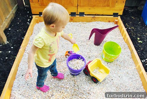 How to Build a DIY Rock Box for Portable Music Playback 12 Child digging in rock sandbox
