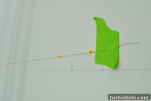 How to Hang Artwork Above a Bed: Placement and Tips 6 Thread level guide on wall