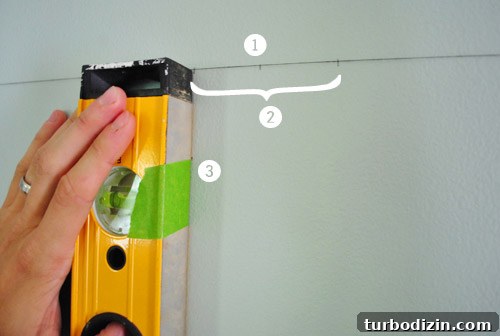 How to Hang Artwork Above a Bed: Placement and Tips 9 Marking the wall for screw placement