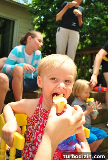 Worm-Themed Birthday Party Ideas and Decorations 23 Clara eating cupcake