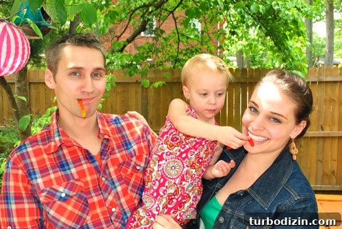 Worm-Themed Birthday Party Ideas and Decorations 25 Clara feeding gummy worms