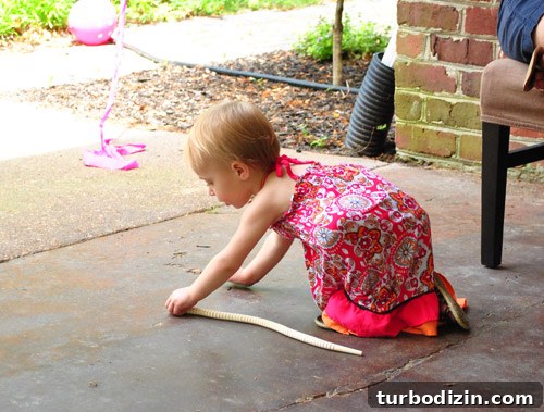 Worm-Themed Birthday Party Ideas and Decorations 28 Clara enjoying her gift
