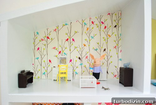Detail Of Dollhouse Room With Olivia The Pig Dolls And Bird Wallpaper
