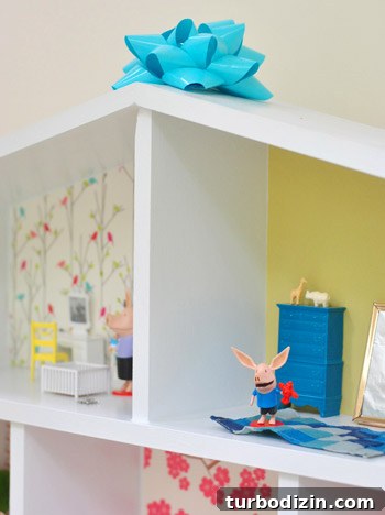 Bow On Top Of DIY Homemade Dollhouse Build For Daughter