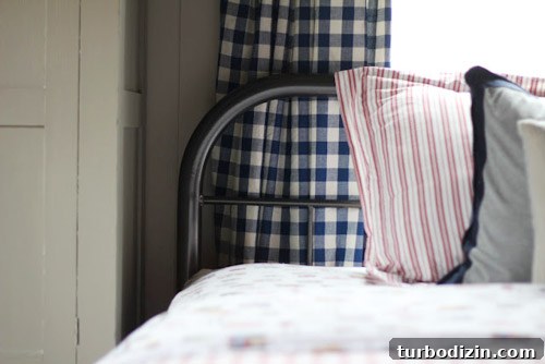 Boy’s Bedroom with Wood-Plank Ceiling and Checkered Curtains 6 Thrifted duvet and pillows