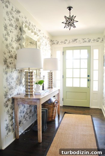 Breezy Bright House: Modern Coastal Home Tour 2 Foyer with scalloped mirror and wallpaper