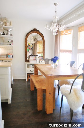 Breezy Bright House: Modern Coastal Home Tour 13 Dining area with chandelier