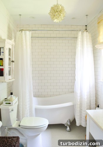Breezy Bright House: Modern Coastal Home Tour 20 Bathroom tub and penny tile floor