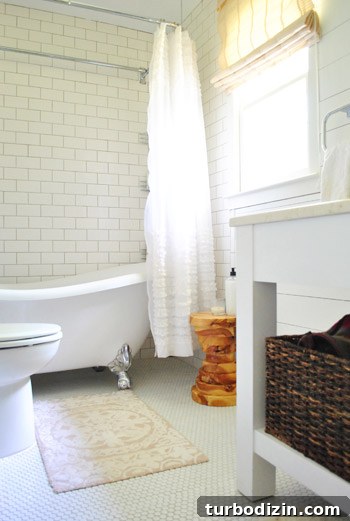 Breezy Bright House: Modern Coastal Home Tour 21 Wood stool in bathroom